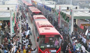 People celebrating inauguration of Metro Bus system in Lahore,Photo:The News International